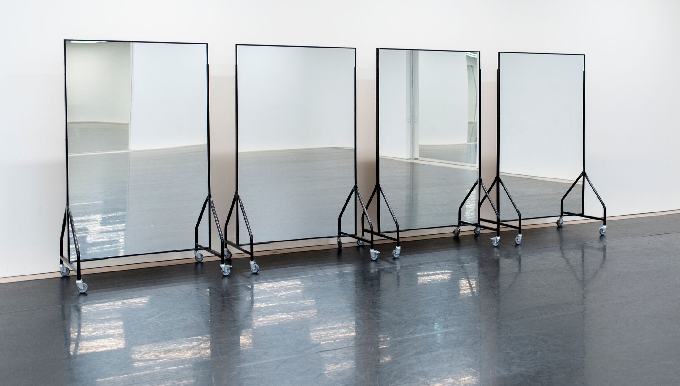 Mobile mirrors in Studio Wayne McGregor for flexible event spaces and workshops.