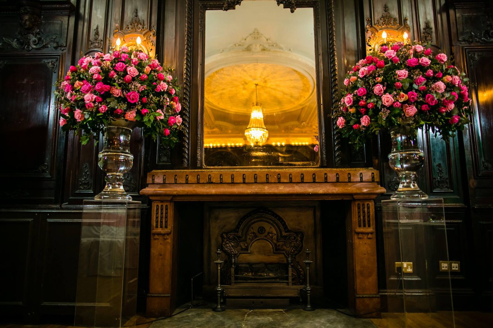 Elegant Churchill Room in Dartmouth House with grand fireplace, ideal for upscale weddings.