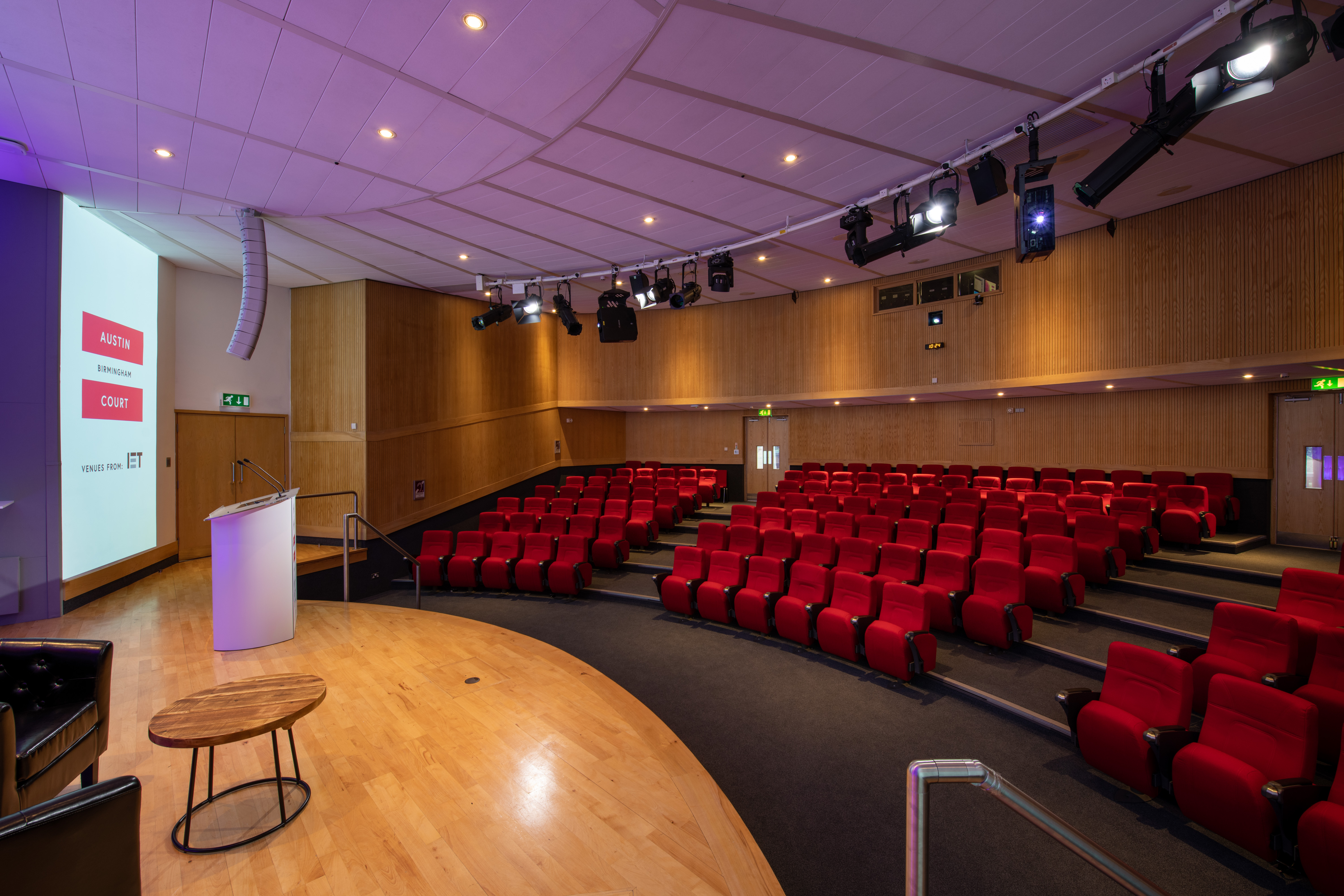 Kingston Theatre auditorium with tiered red seating for professional events and presentations.