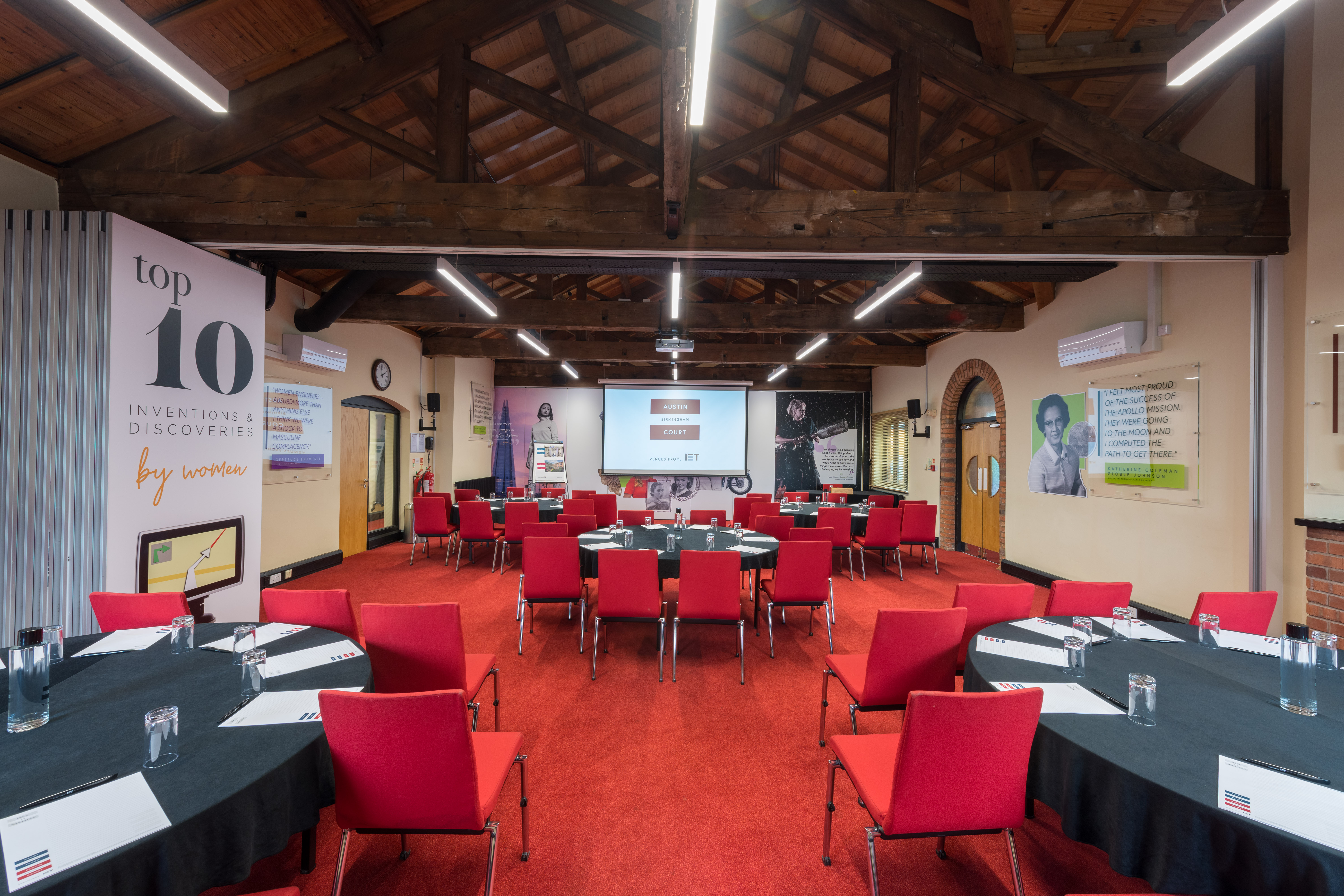 Lodge Room 1 at IET Birmingham: modern meeting space with circular tables for conferences.