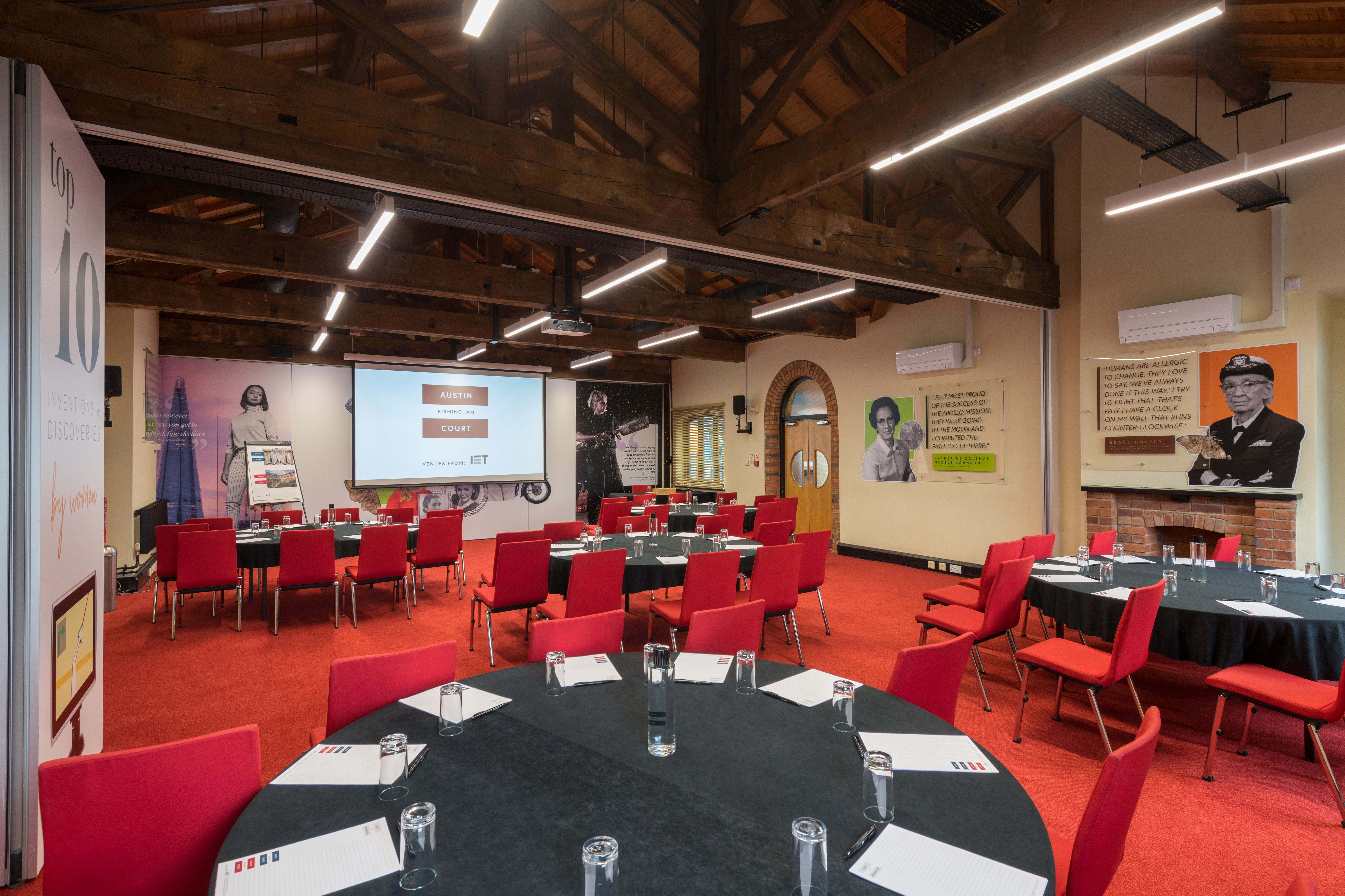 Lodge Room 1 at IET Birmingham: modern meeting space with round tables for events.