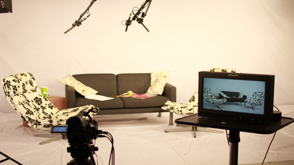 Cozy TV studio setup with stylish seating for virtual events and interviews.