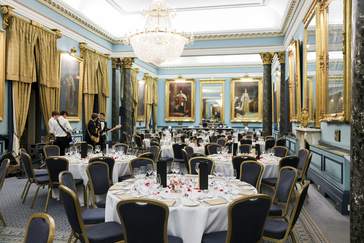 Elegant Nash Room banquet setup with chandelier, perfect for formal events and entertainment.