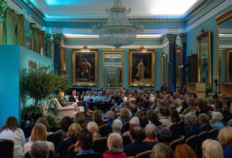 Panel discussion in Nash Room, 116 Pall Mall, featuring elegant decor and engaged audience.