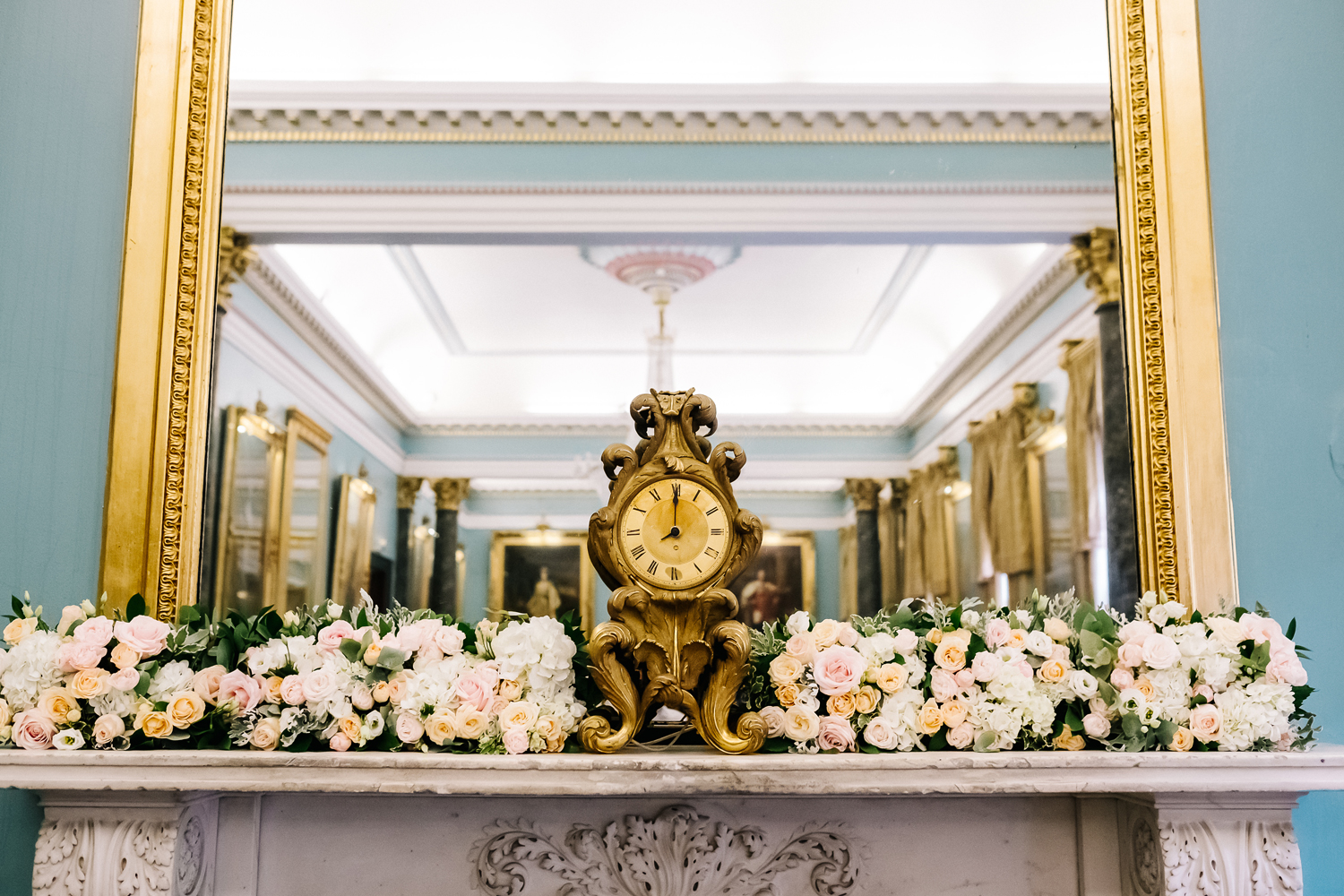 Elegant Nash Room at 116 Pall Mall with ornate clock, perfect for upscale events.