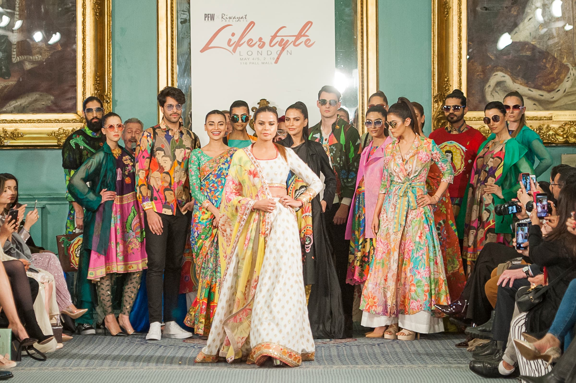 Fashion show in ornate Nash Room, 116 Pall Mall, featuring colorful runway style and event decor.