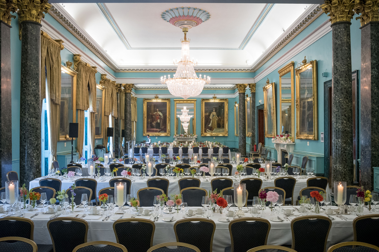 Elegant Nash Room banquet hall with floral centerpieces, ideal for weddings and corporate events.