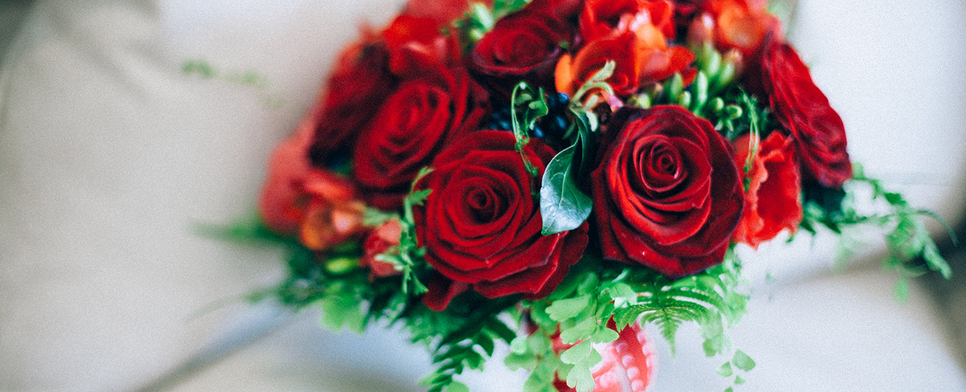 Windsor Suite at The Milestone Hotel with vibrant red rose bouquet for weddings and events.