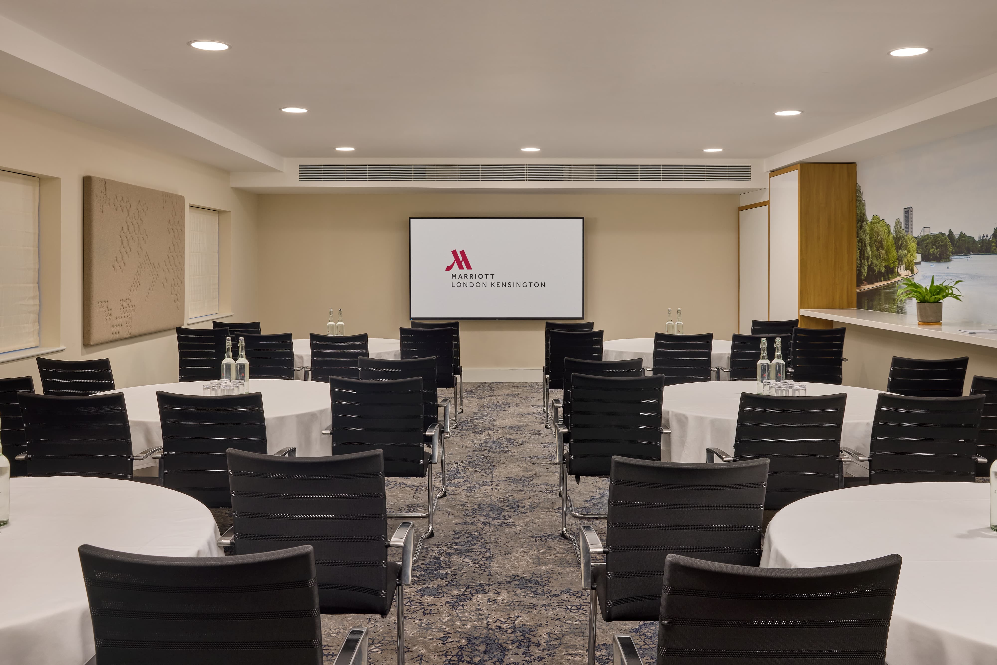 Cabaret-style breakout room at London Marriott Kensington for corporate workshops and training.