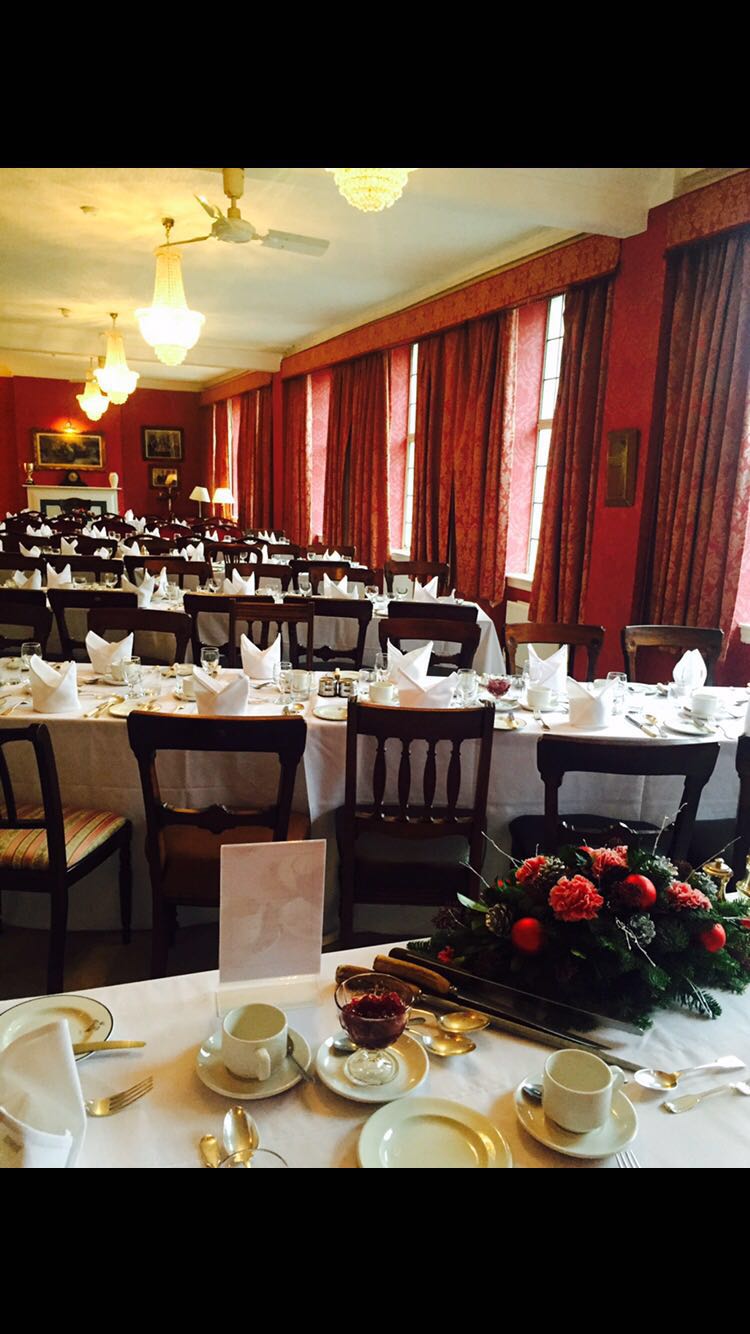 Elegant Villiers Suite dining room with red walls, perfect for corporate events and banquets.