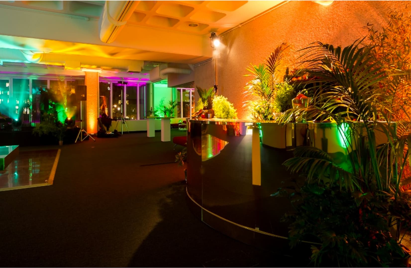 Pickwick event space at QEII Centre with vibrant lighting, ideal for corporate networking events.