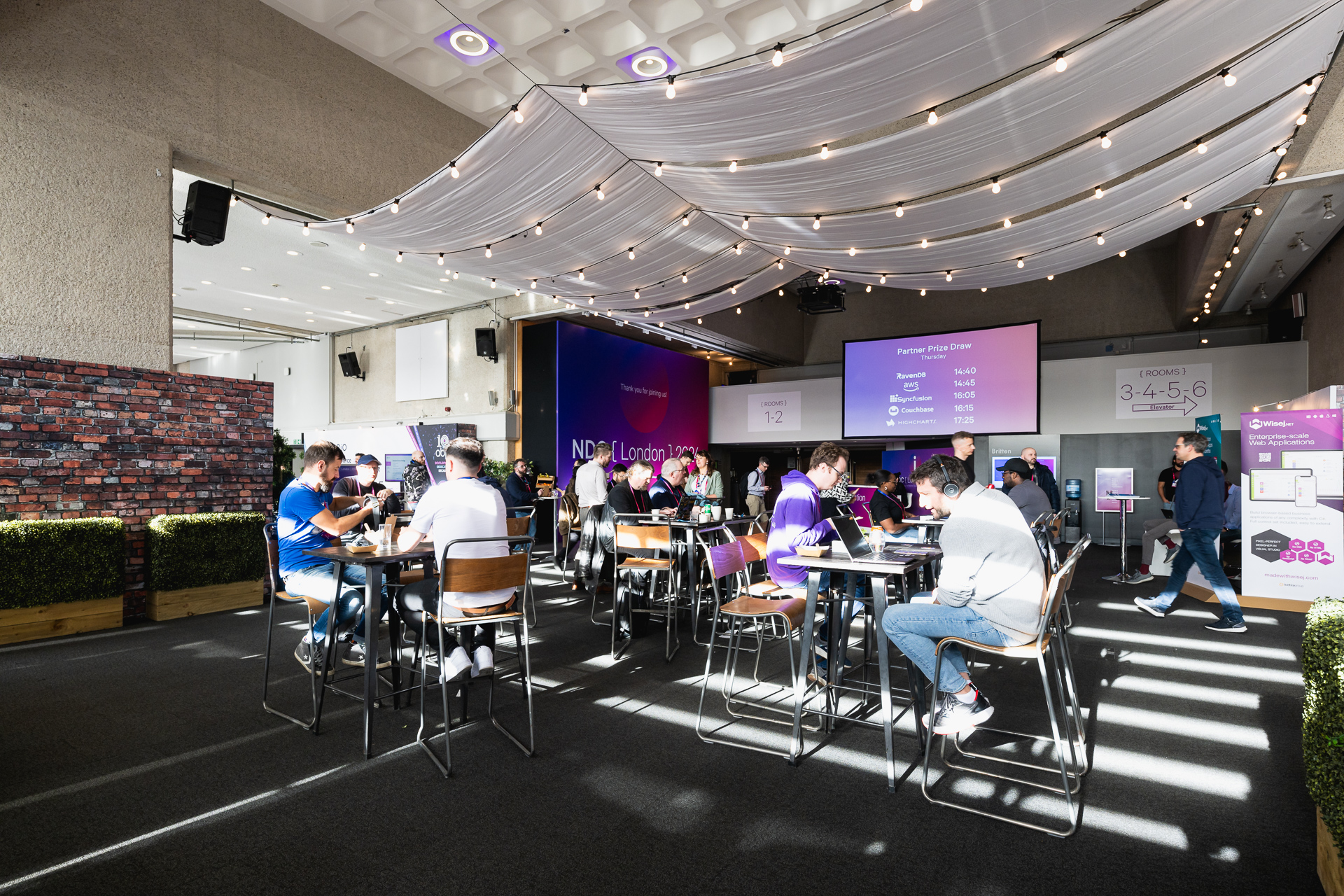 Modern event space with stylish seating for networking at QEII Centre.