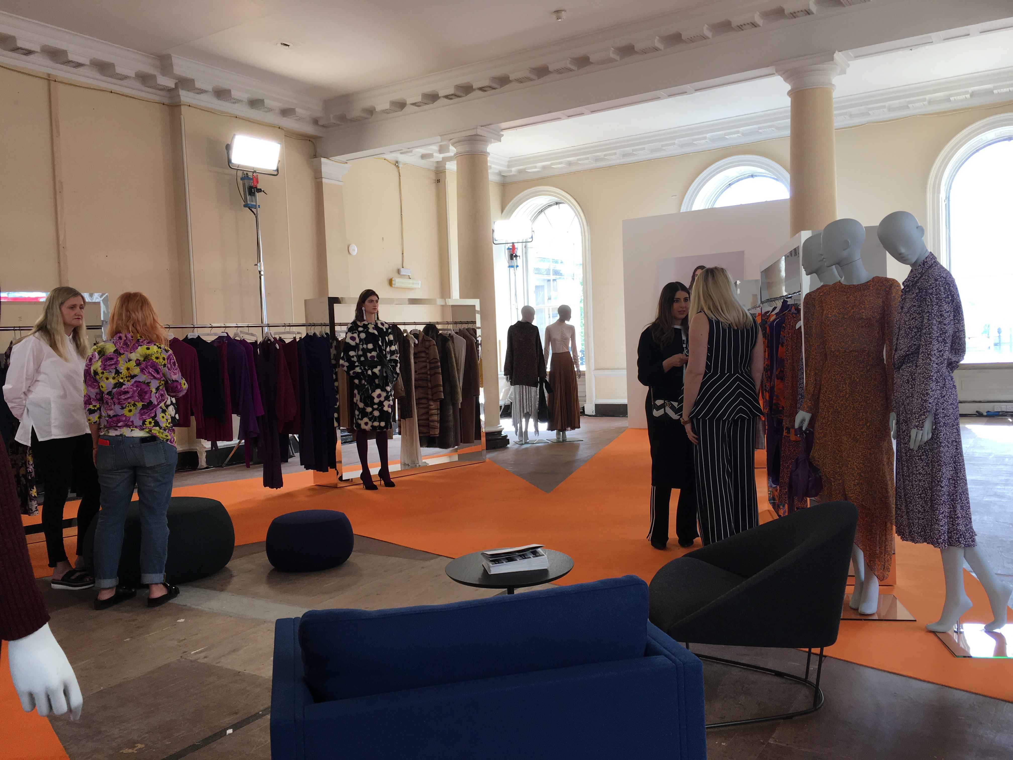 Stylish event space at Somerset House for a vibrant fashion showcase with mannequins.