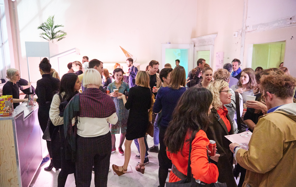 Vibrant networking event at The River Rooms, Somerset House, with casual attire and creative decor.