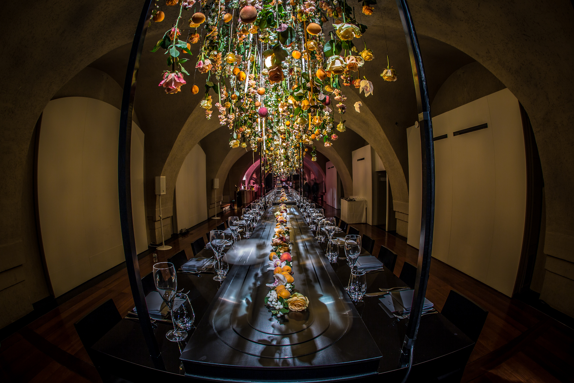 Elegant dining setup at The Embankment Galleries with floral installation for upscale events.
