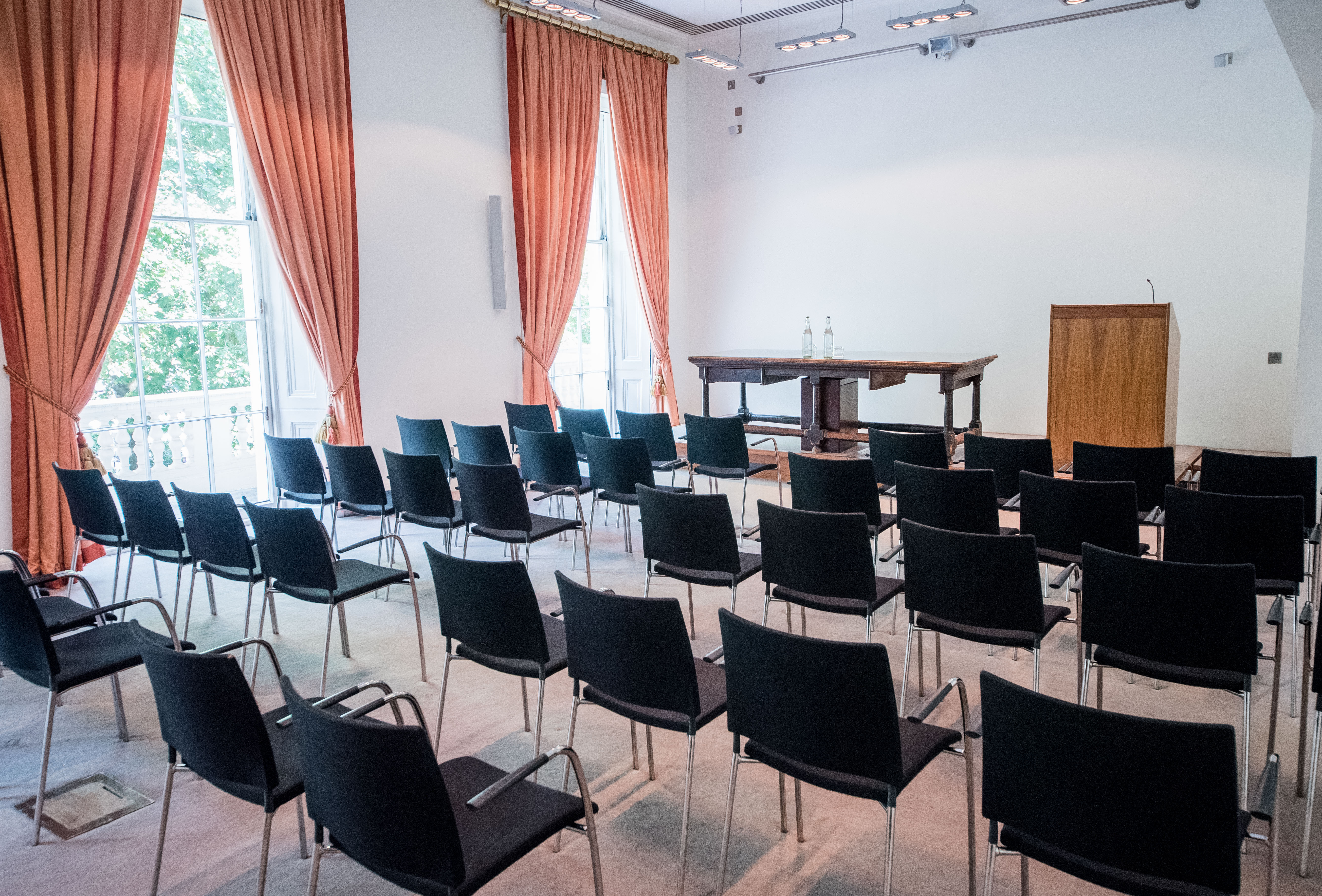 Conference Room at The Royal Society with black chairs, ideal for presentations and workshops.