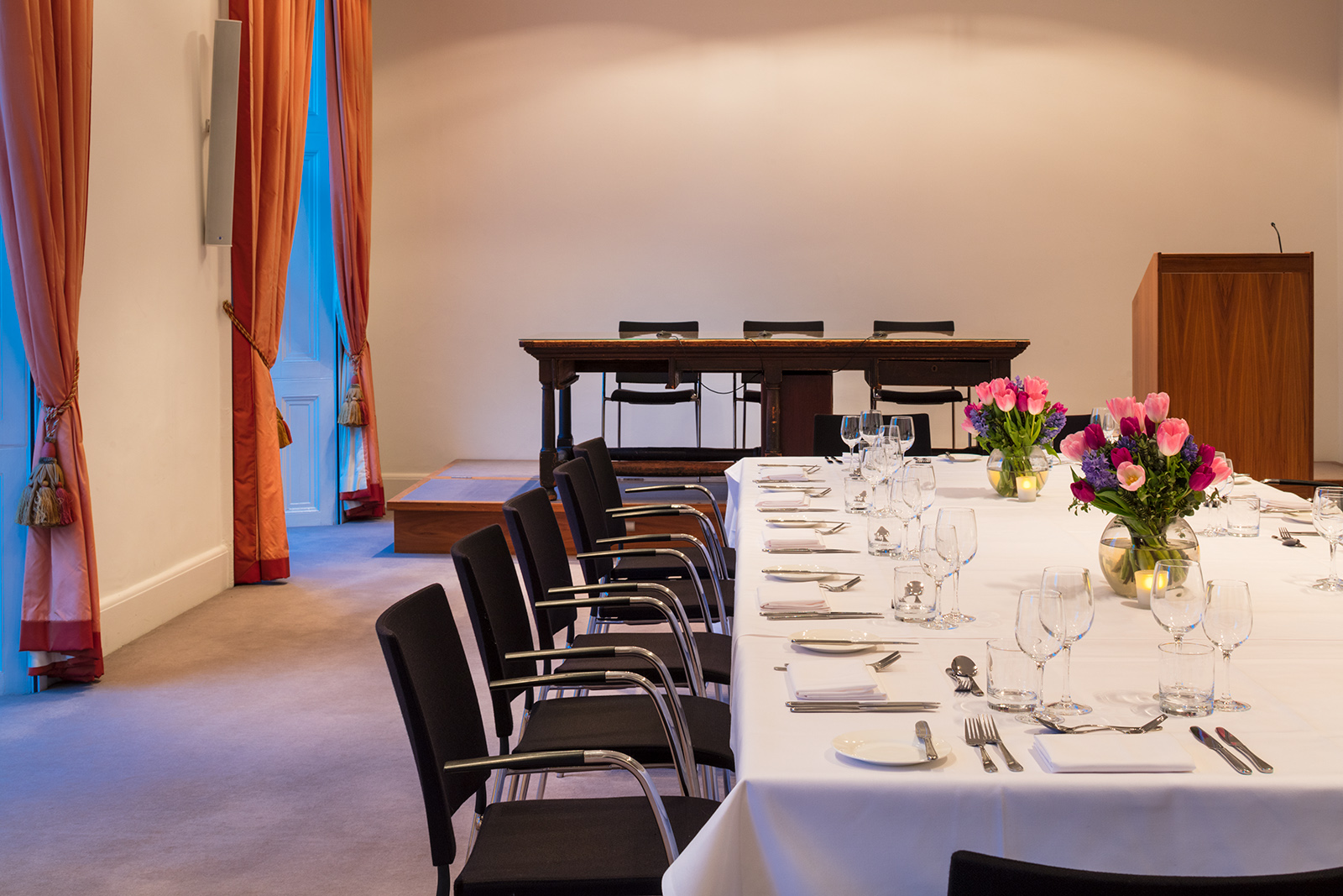 Elegant conference room with long table, ideal for intimate meetings and events.