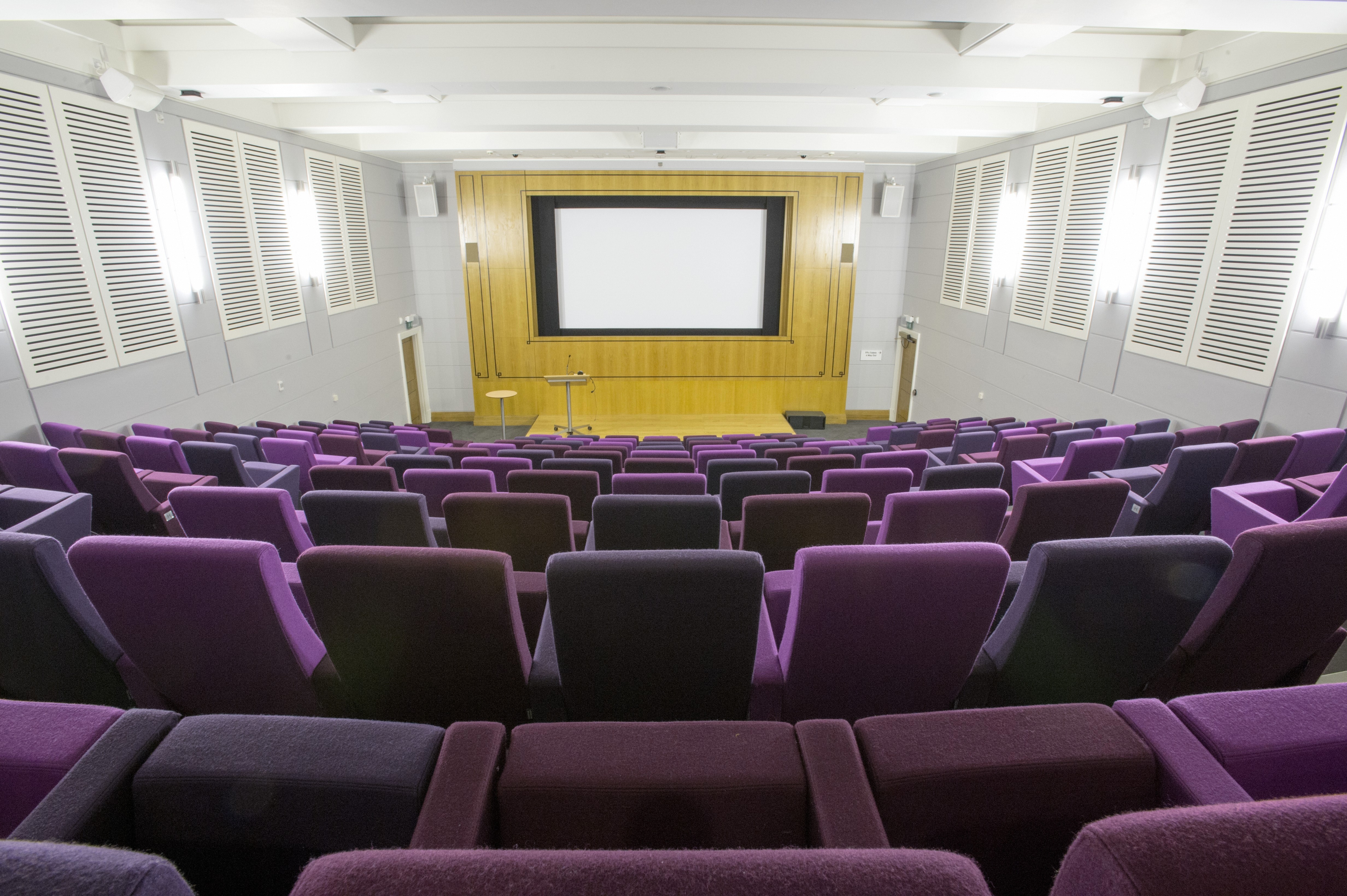 Henry Wellcome Auditorium with tiered seating, ideal for conferences and lectures.