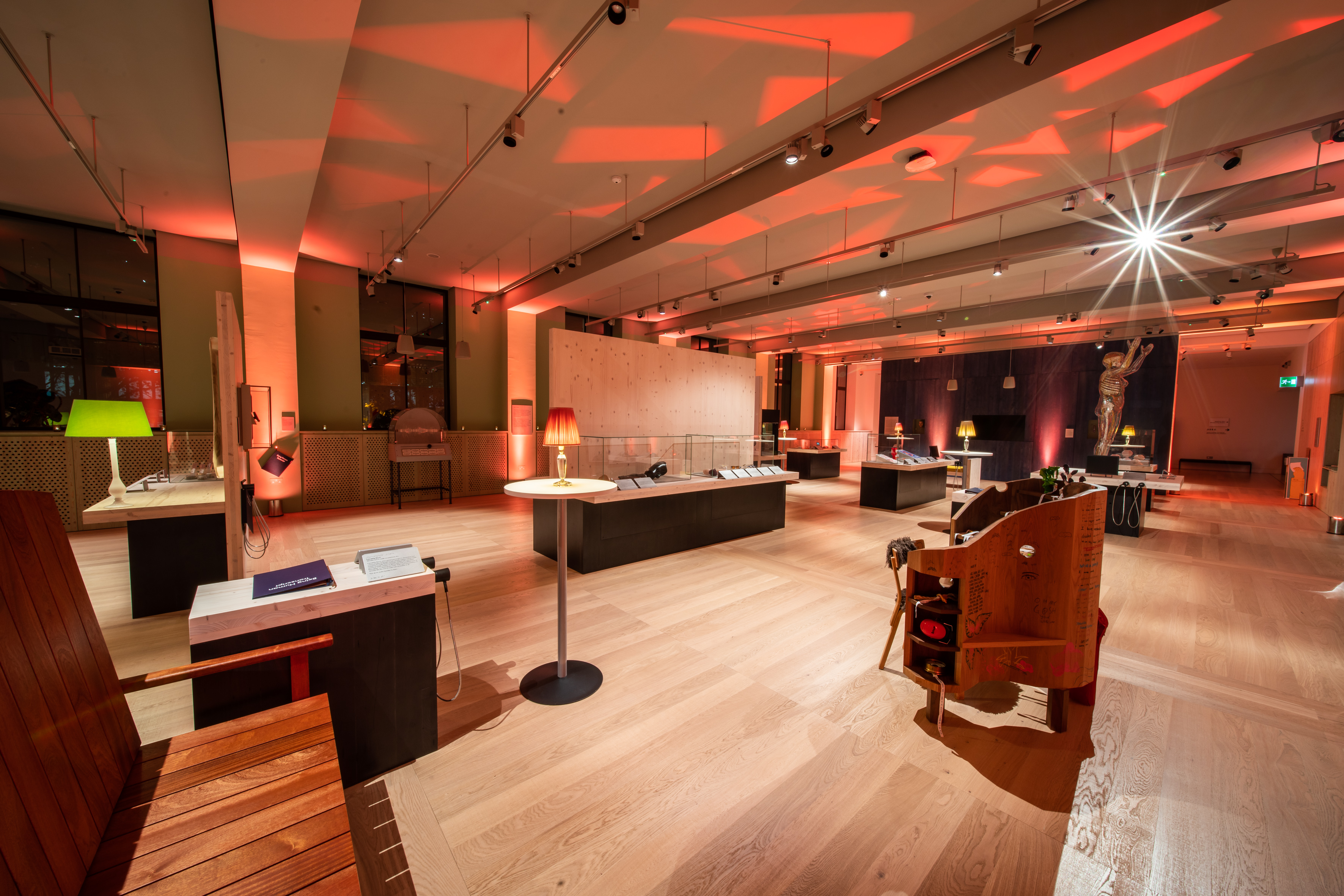 Being Human Exhibition at Wellcome Collection, modern event space with warm lighting.