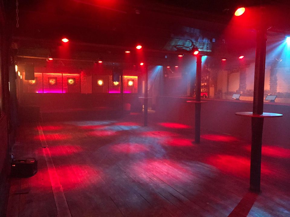 Versatile event space with dynamic lighting for parties and corporate events.