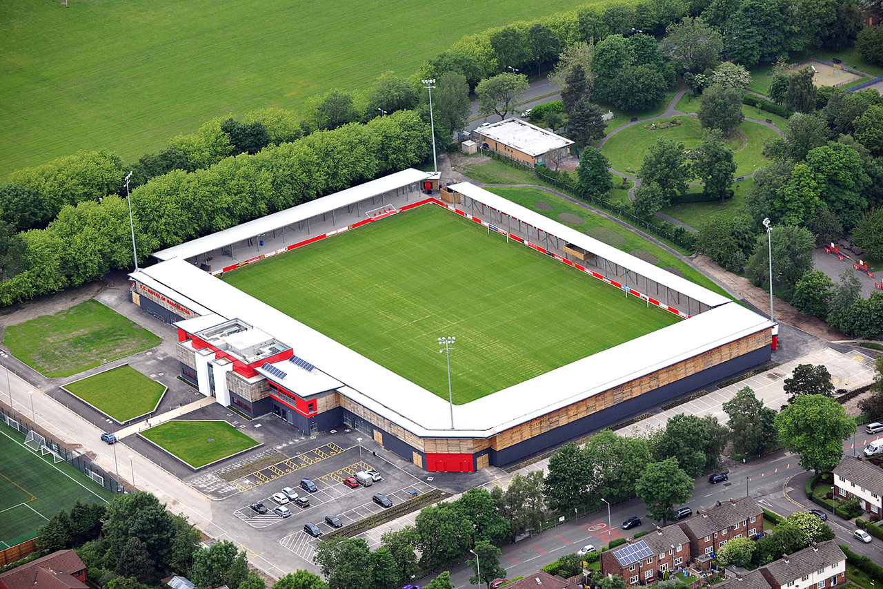 FC United of Manchester stadium with green field, ideal for sports and corporate events.