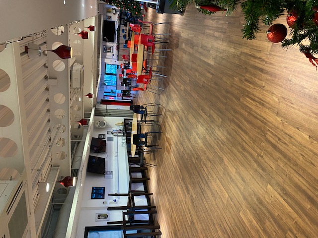 Versatile event space with wooden flooring for meetings and gatherings at FC United of Manchester.