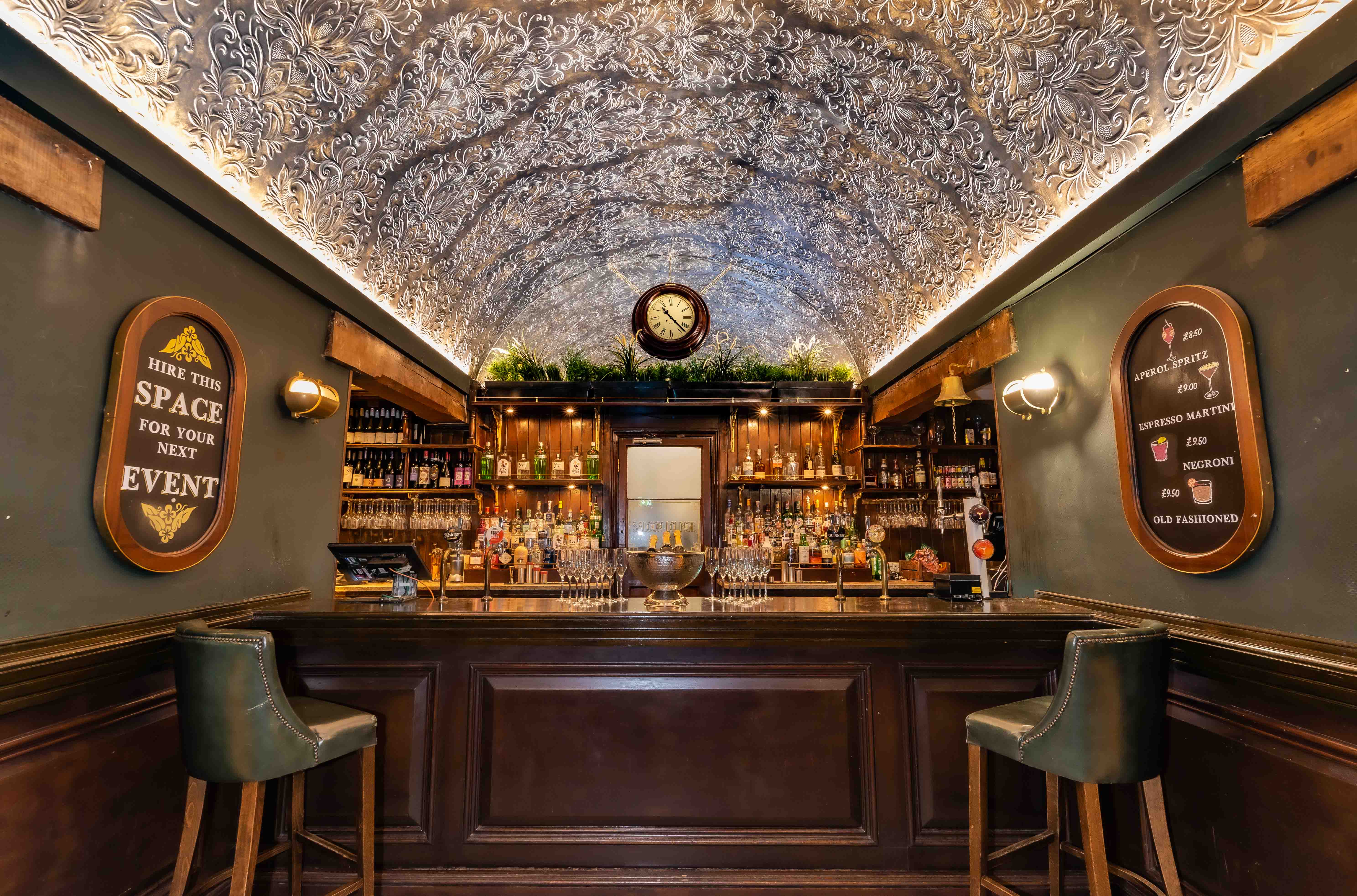 Stylish Vault Bar with ornate ceiling, perfect for intimate gatherings and networking events.
