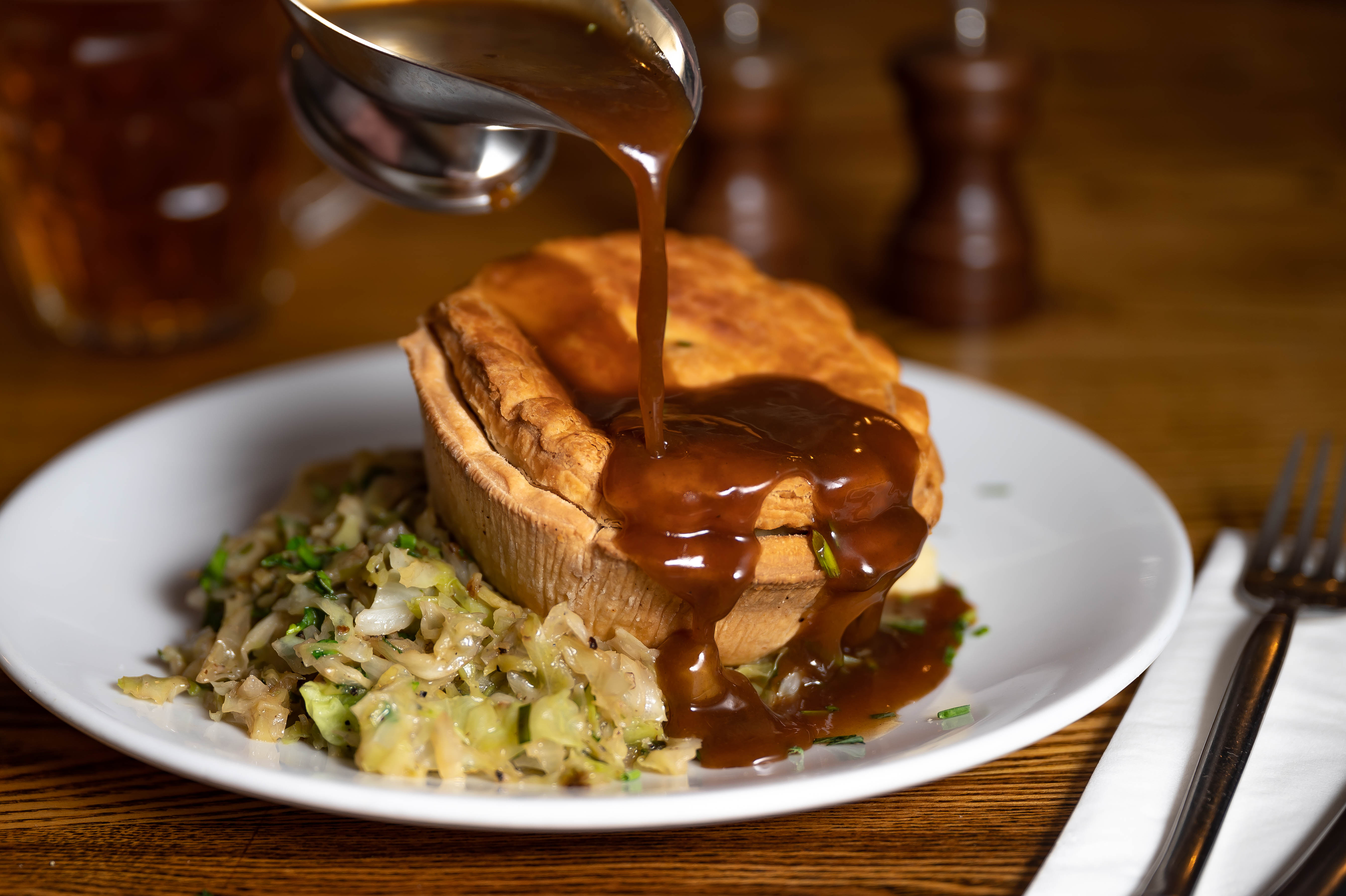 Savory pie with gravy at The Vault Bar, ideal for events and catering.