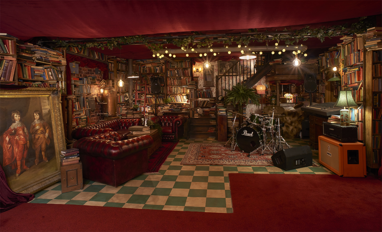 Cozy eclectic event space with vintage charm, perfect for gatherings and performances.