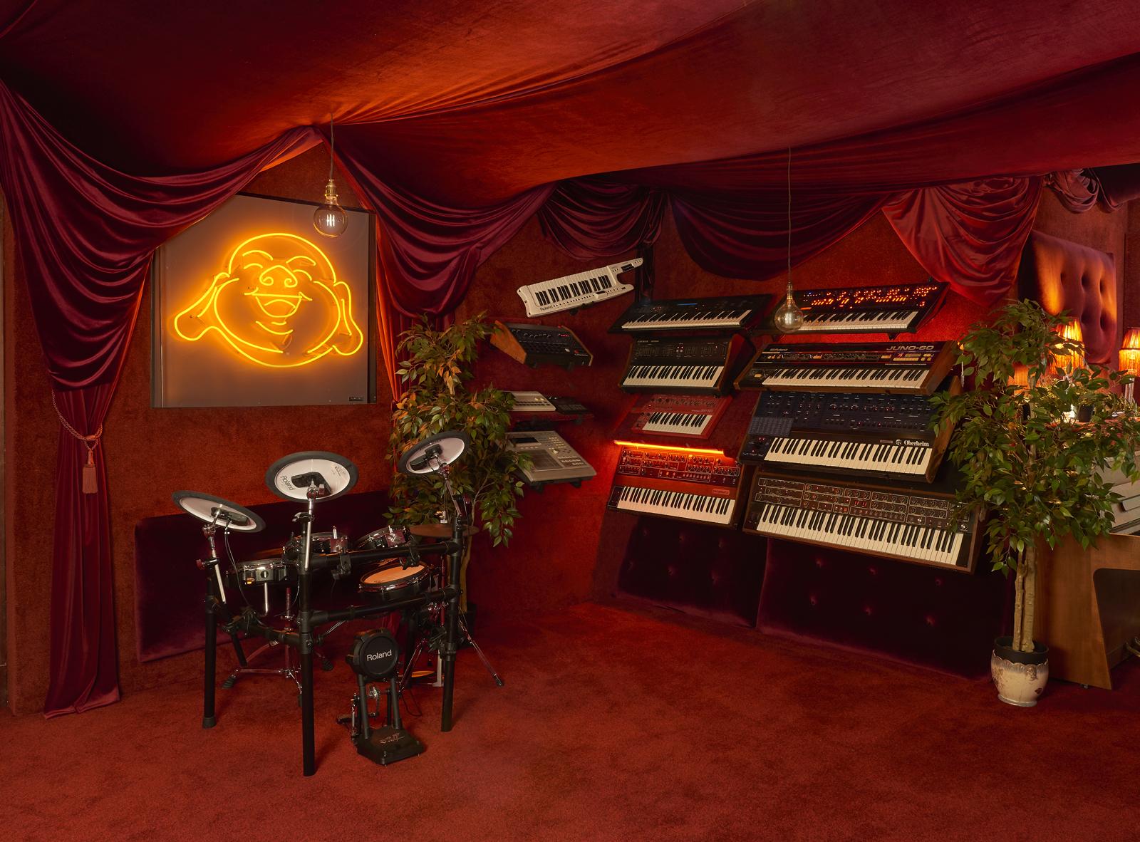 Vibrant event space at Fiction Studios with musical instruments for workshops and gatherings.
