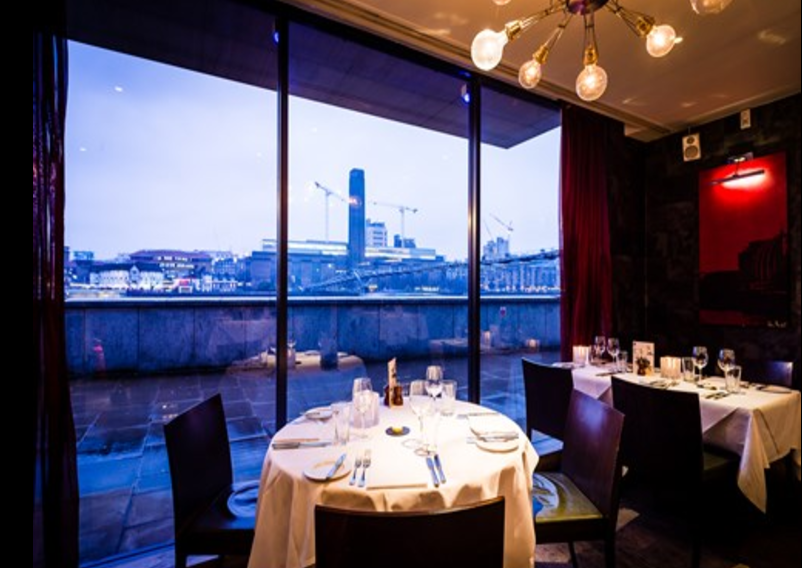 Private dining at Northbank Restaurant with elegant table setting and skyline view