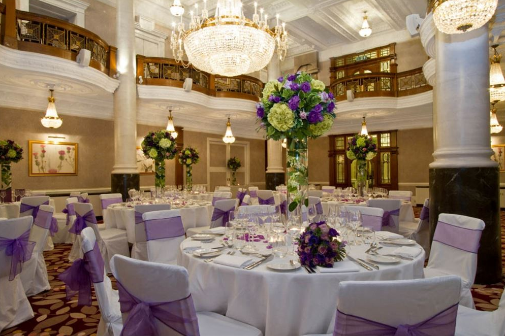 Elegant Crystal Ballroom with purple accents, ideal for weddings and corporate events.