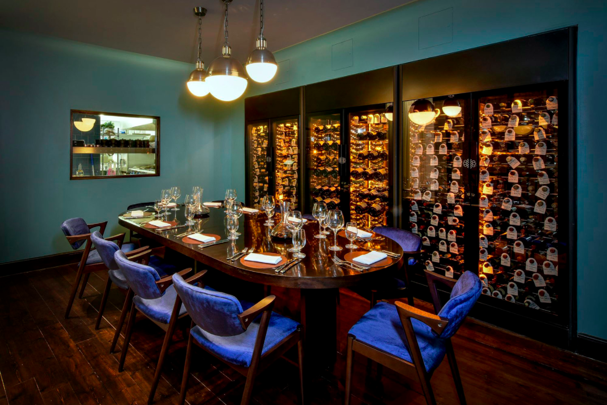 Intimate dining space in The Magnum Room, ideal for corporate dinners and exclusive events.