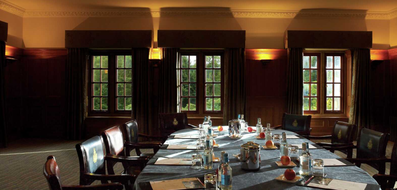 Meeting room at Pennyhill Park with natural light, ideal for corporate events.
