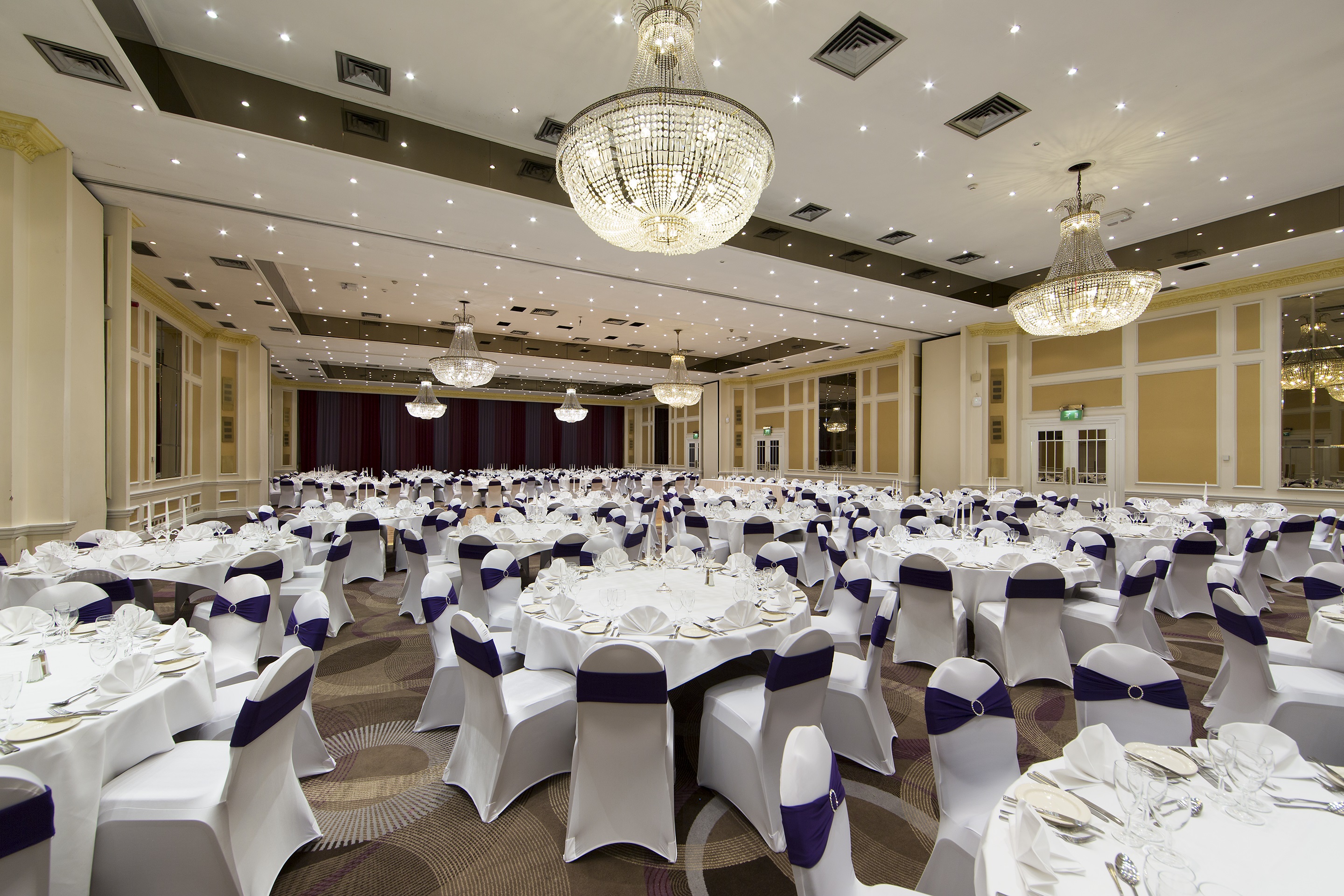 Aviation Suite banquet hall at Thistle London Heathrow, elegant event space with purple accents.