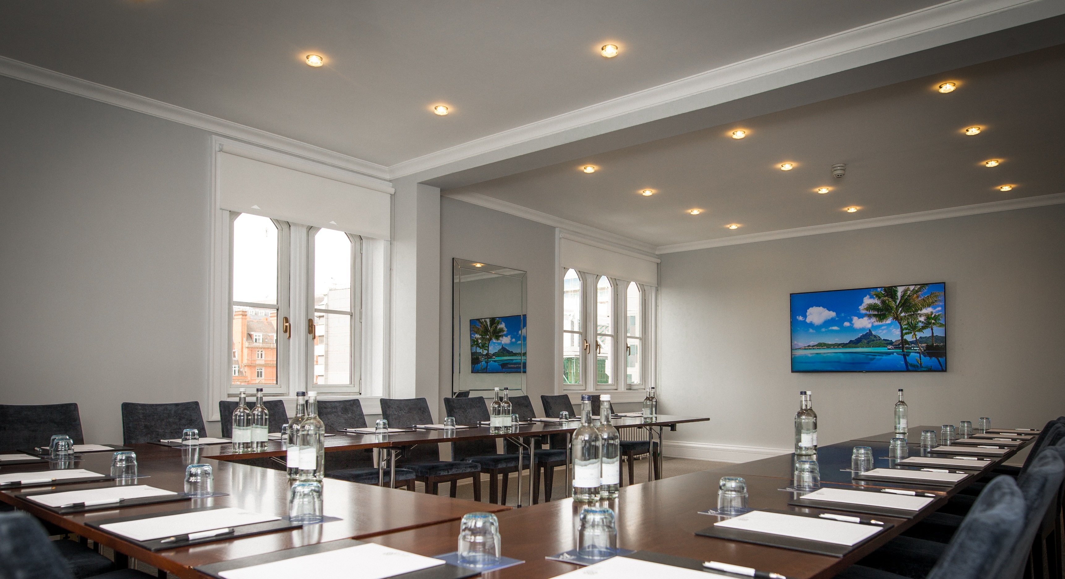 Trafalgar Room in Arundel House: modern meeting space with natural light for professional events.