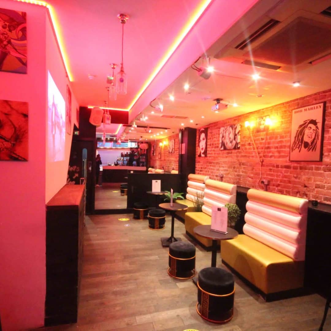 Private hire event space in CC Lounge Bar with exposed brick walls and stylish seating.