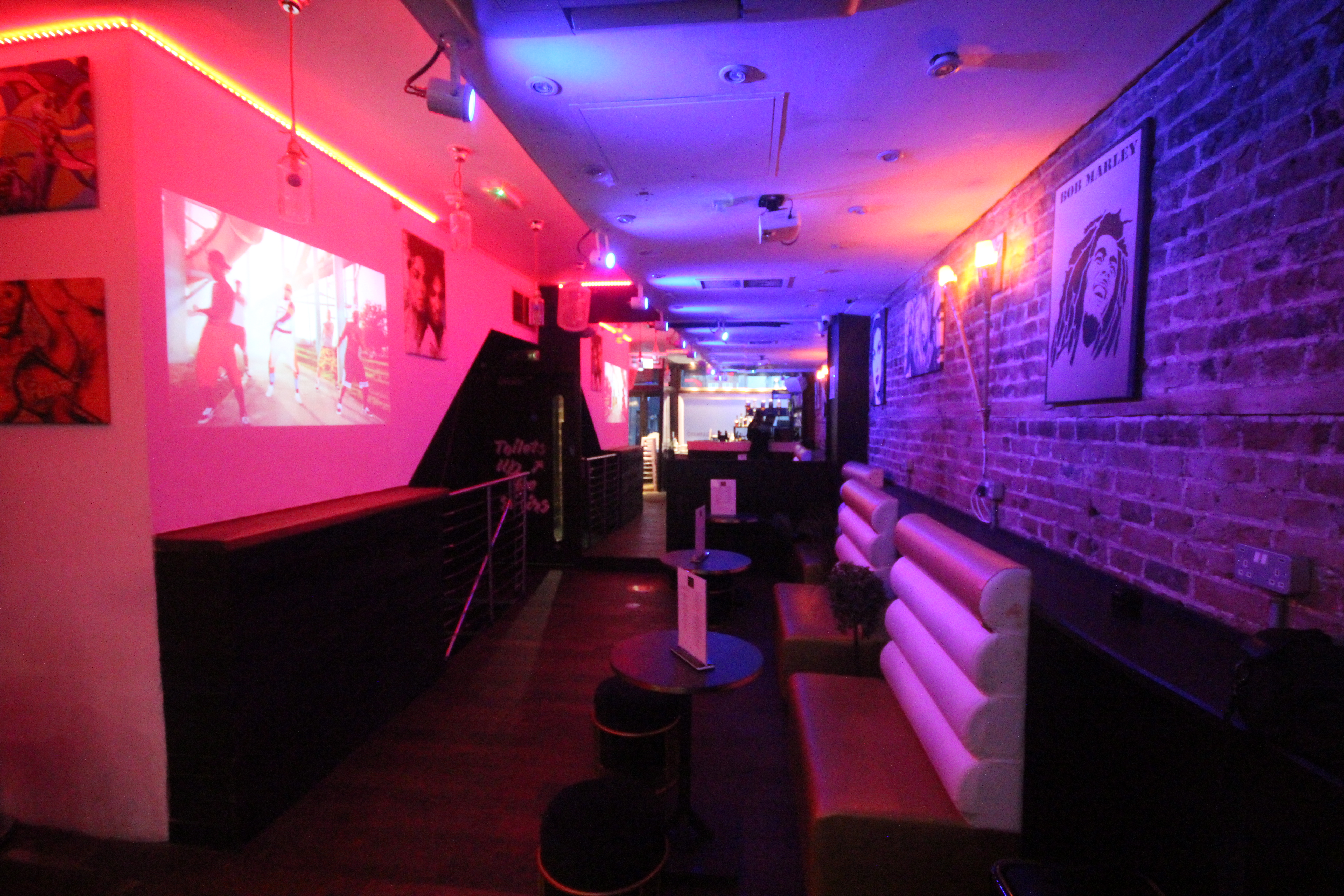 Private hire event at CC Lounge Bar with vibrant lighting and modern decor.