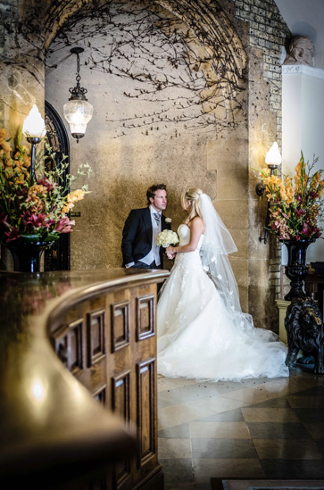 Elegant wedding scene in The Balmoral Suite, Pennyhill Park with romantic floral arrangements.