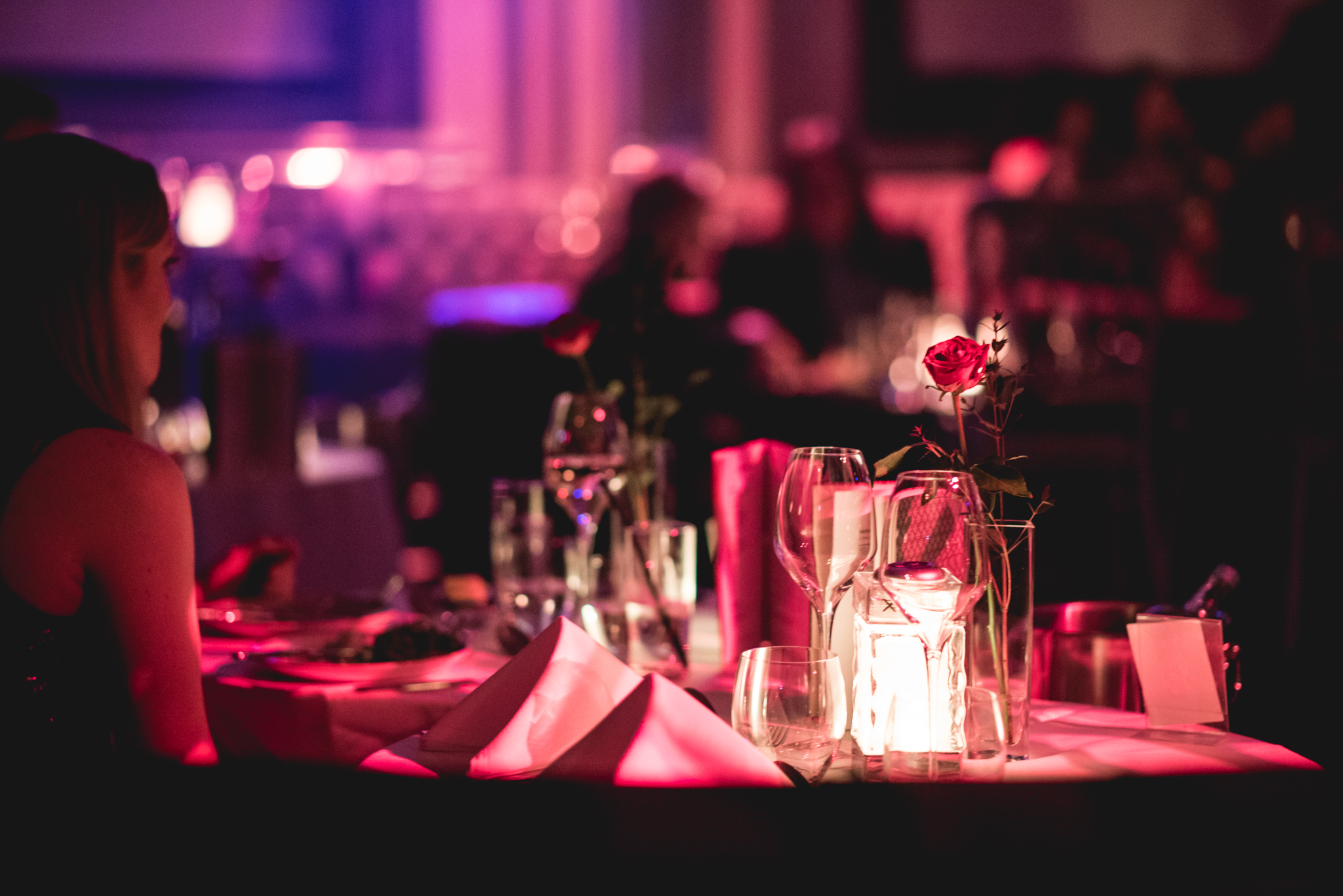 Elegant dining table with roses at London Cabaret Club gala dinner event.