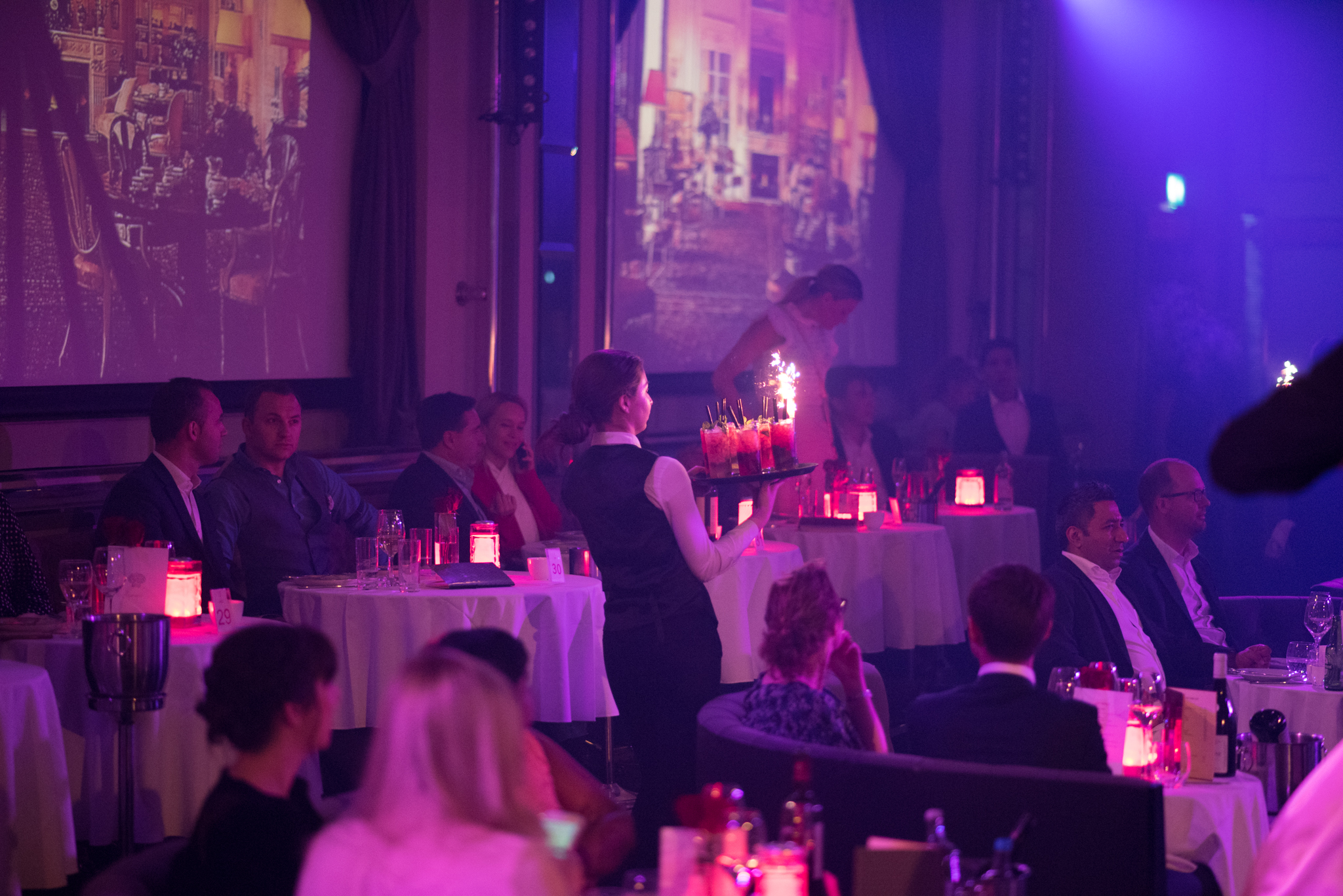 London Cabaret Club event with elegantly dressed guests and sparkling dessert presentation.