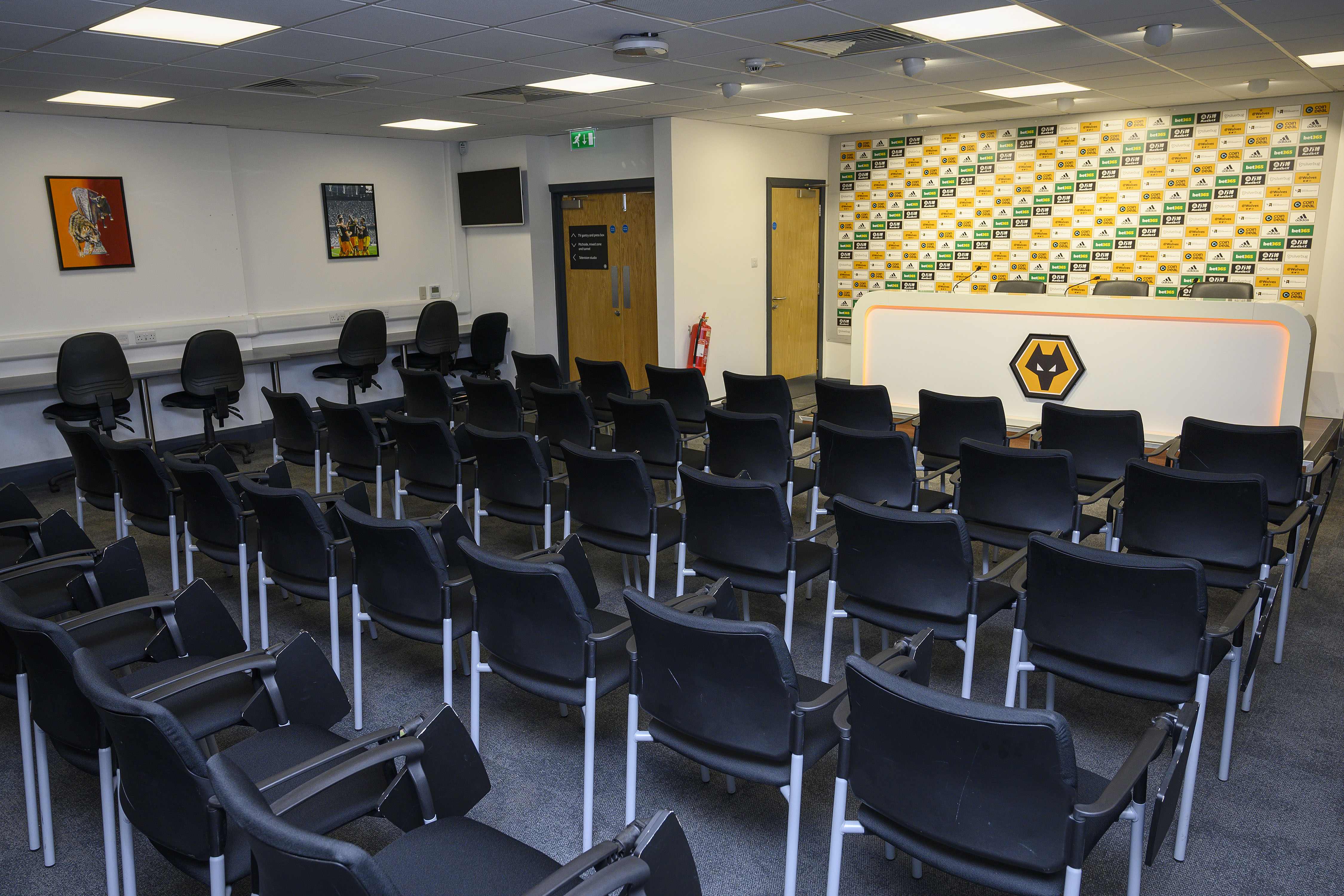 Media Suite at Molineux Stadium: modern meeting space with black chairs for events.
