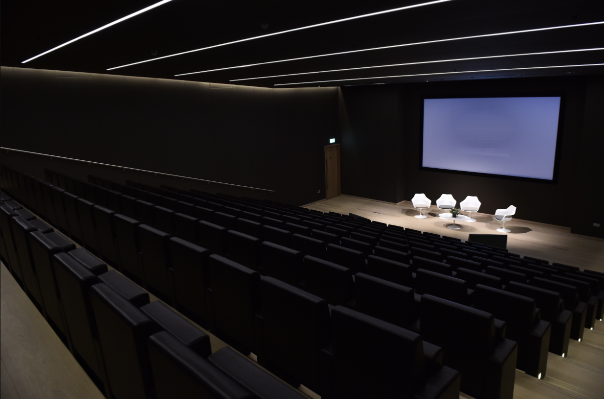 Bakala Auditorium with tiered seating, perfect for panel discussions and events.