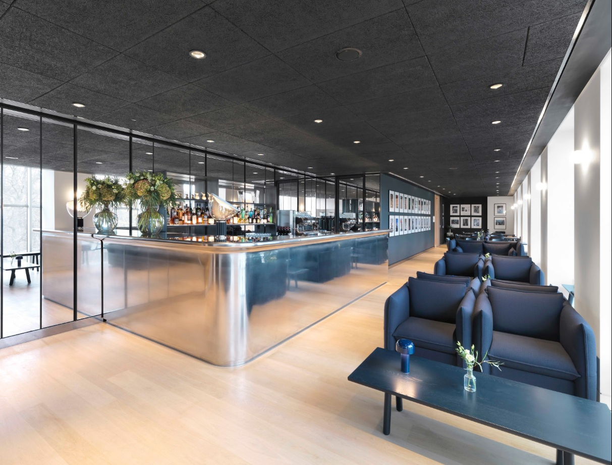 Chumsri and Luqman Lounge, modern event space with polished bar, ideal for corporate gatherings.