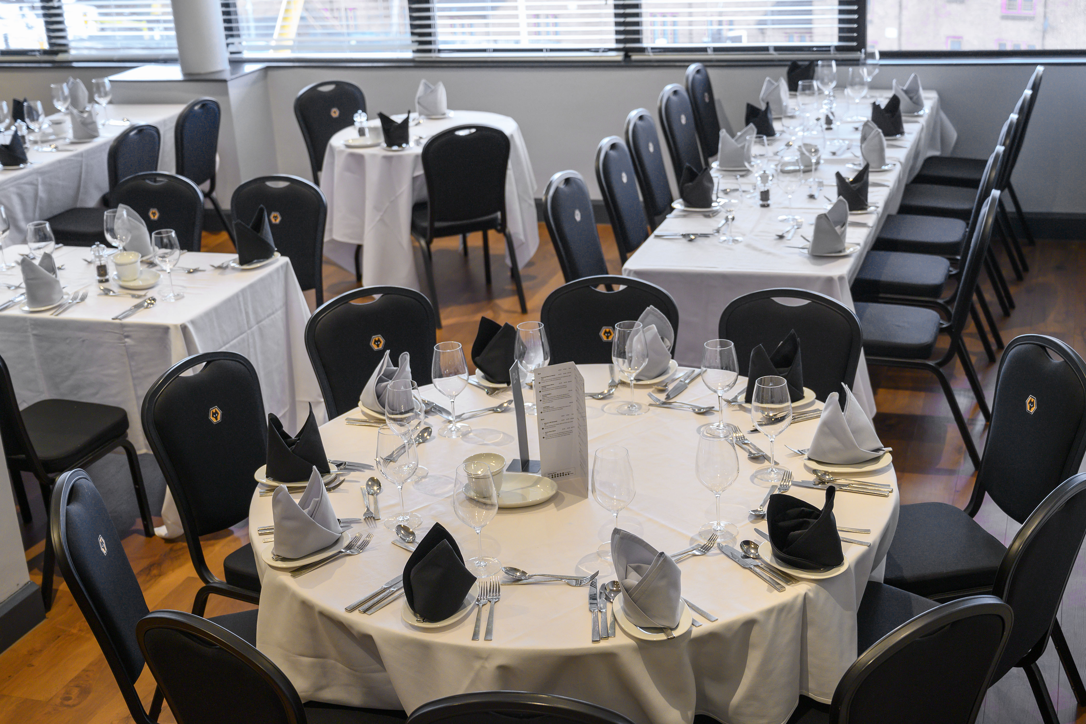 Boardroom at Molineux Stadium, elegant dining setup for corporate events.