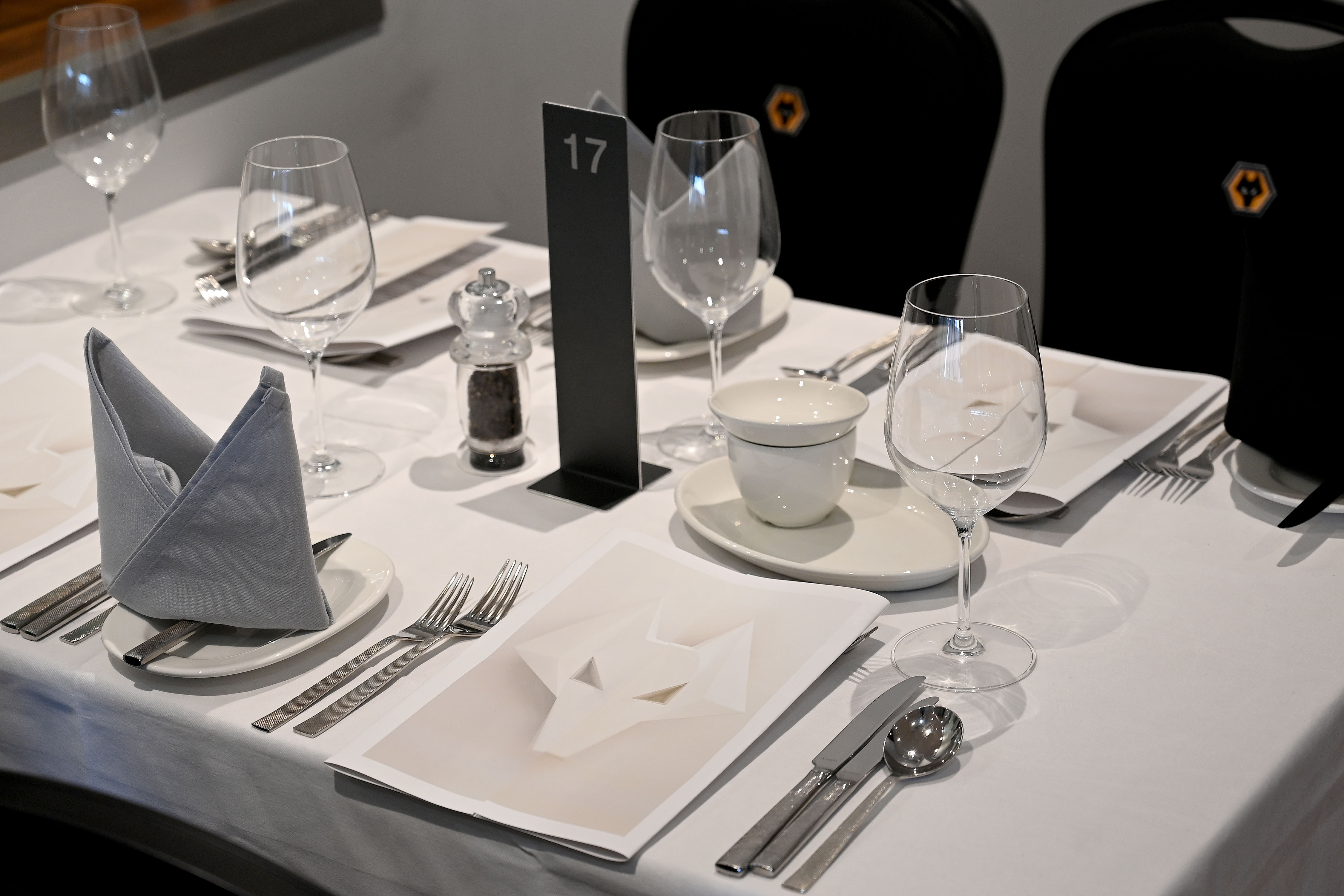 Elegant dining table setup in Molineux Stadium for corporate events and formal dinners.