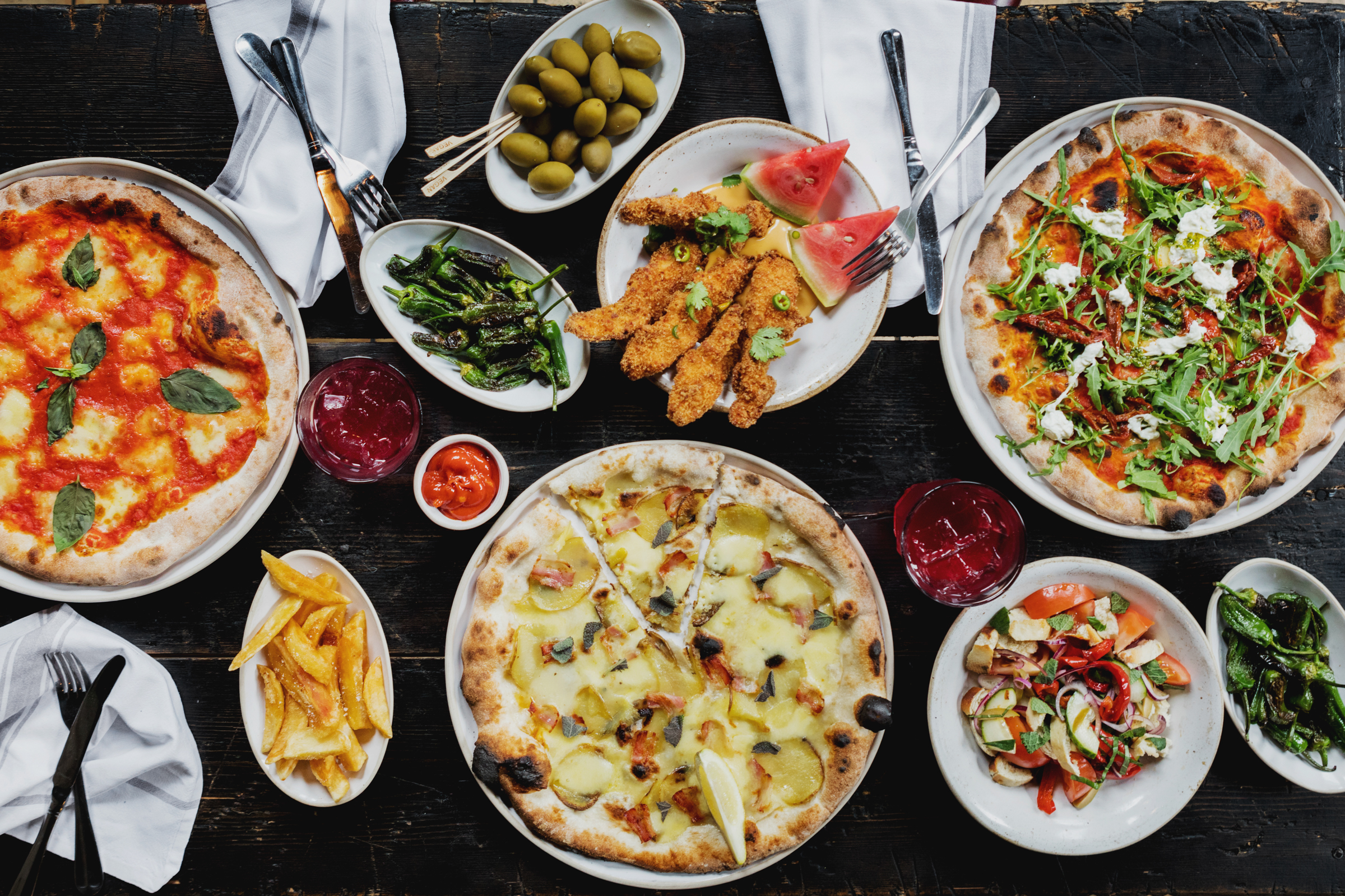 Vibrant pizza spread at Martello Hall for casual networking event or team lunch.