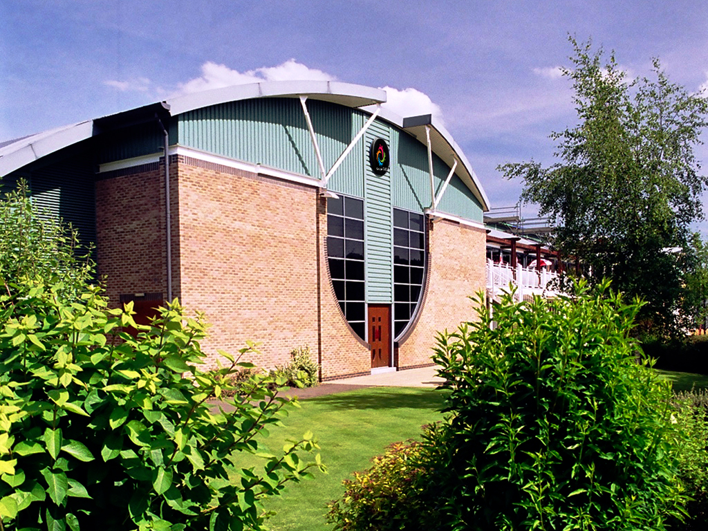 Modern event venue exterior with large windows, perfect for corporate and social gatherings.