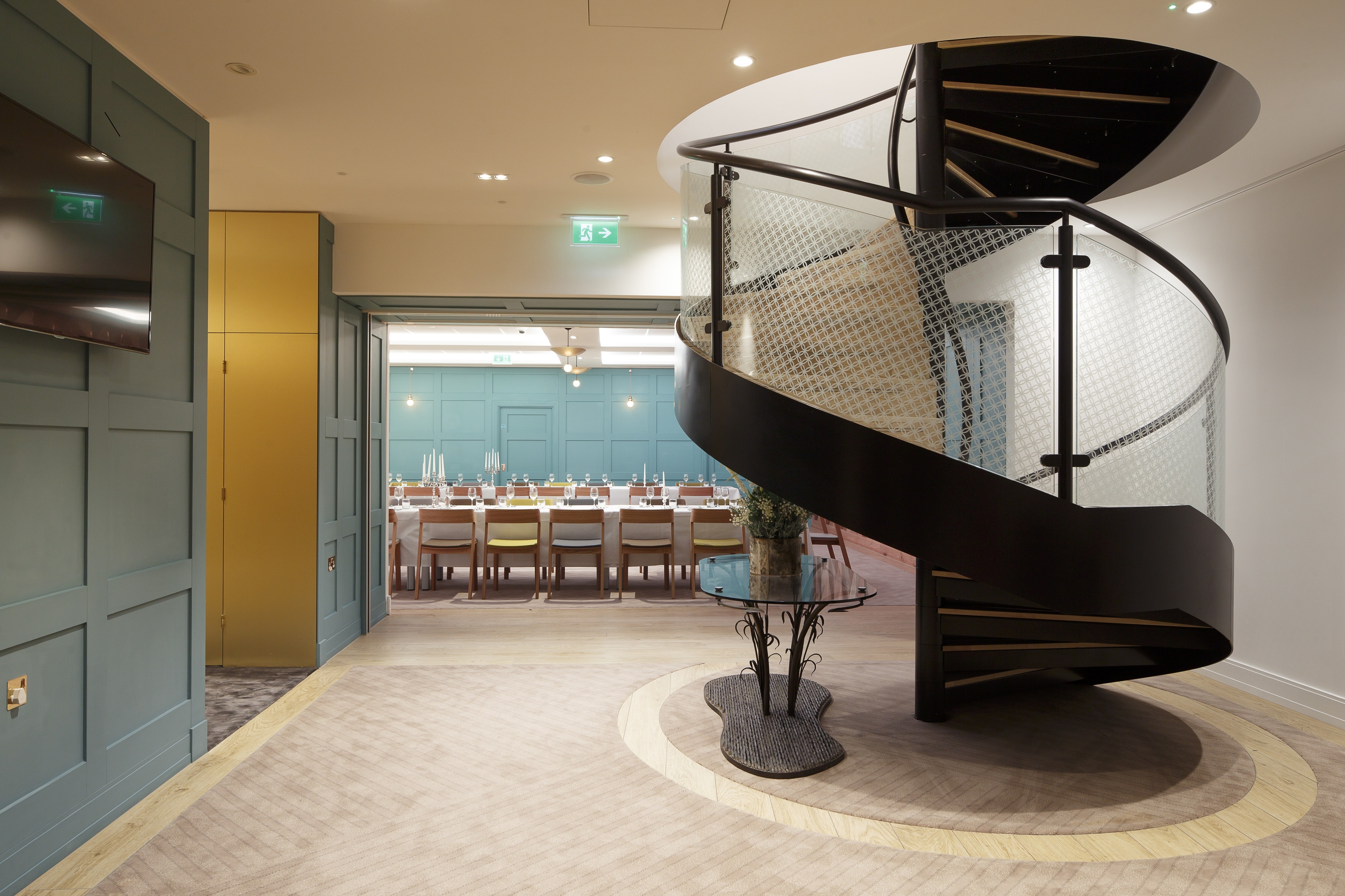 Stylish Great Hall with spiral staircase, ideal for upscale meetings and events.
