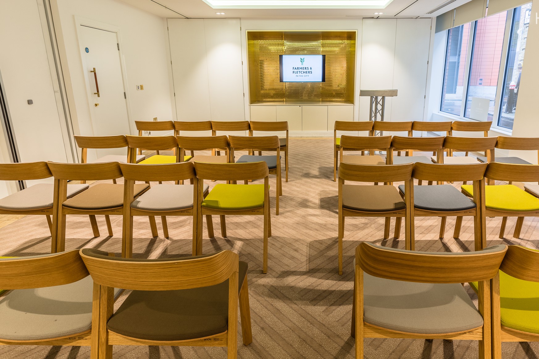 Court Room at Farmers & Fletchers, wooden chairs for workshops and conferences.